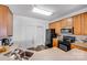Well-maintained kitchen featuring wood cabinets, black appliances, and neutral countertops at 10316 Stineway Ct, Pineville, NC 28134