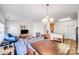 Open-concept living and dining area with hardwood floors and ample space for entertaining at 10316 Stineway Ct, Pineville, NC 28134