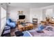 Comfortable living room with a fireplace, hardwood floors, and a large sectional sofa at 10316 Stineway Ct, Pineville, NC 28134