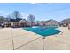 Community pool with a cover, clubhouse, and lots of seating for residents to enjoy at 10316 Stineway Ct, Pineville, NC 28134