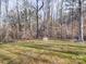 Spacious backyard with mature trees and peaceful scenery, ideal for outdoor relaxation at 1085 Cedar Hill Dr, Rockwell, NC 28138