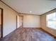 Bedroom featuring neutral walls, durable floors, and large window providing natural light at 1085 Cedar Hill Dr, Rockwell, NC 28138