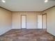 Bedroom featuring durable floors, neutral walls, and convenient access to other rooms at 1085 Cedar Hill Dr, Rockwell, NC 28138