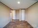 Bedroom featuring durable floors, neutral walls, and convenient access to the rest of the home at 1085 Cedar Hill Dr, Rockwell, NC 28138
