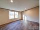 Cozy bedroom with new flooring, natural light, and ample space for relaxation and personalization at 1085 Cedar Hill Dr, Rockwell, NC 28138