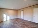 A sunny room features laminate floors at 1085 Cedar Hill Dr, Rockwell, NC 28138