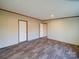 Bright bedroom features durable floors, neutral walls, and convenient access to the rest of the home at 1085 Cedar Hill Dr, Rockwell, NC 28138
