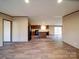 Spacious living room leading into the kitchen, featuring modern flooring and a seamless open layout at 1085 Cedar Hill Dr, Rockwell, NC 28138