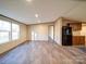 Inviting living room with new flooring, large windows, and seamless integration with the adjacent kitchen at 1085 Cedar Hill Dr, Rockwell, NC 28138