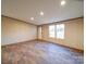 Bright living room featuring new flooring, neutral walls, and recessed lighting providing a warm ambiance at 1085 Cedar Hill Dr, Rockwell, NC 28138