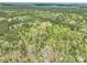 Expansive aerial view of a rural property nestled among dense woodlands and rolling hills at 1766 Duckwood Rd, Lancaster, SC 29720