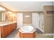 Bright bathroom featuring a soaking tub, double vanity, and a separate shower at 1766 Duckwood Rd, Lancaster, SC 29720