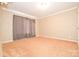 Comfortable carpeted bedroom with curtains and neutral decor at 1766 Duckwood Rd, Lancaster, SC 29720