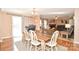 Inviting dining area with wood table and chairs, flowing seamlessly into the living room at 1766 Duckwood Rd, Lancaster, SC 29720