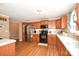 Functional kitchen with stainless steel appliances, wood cabinets, and plenty of counter space at 1766 Duckwood Rd, Lancaster, SC 29720