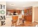 Kitchen with stainless steel appliances, wood cabinets and countertops and breakfast bar seating at 1766 Duckwood Rd, Lancaster, SC 29720