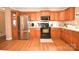 Charming kitchen with modern appliances, wood cabinets, and a functional layout at 1766 Duckwood Rd, Lancaster, SC 29720