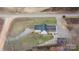 Aerial view of a house with a spacious yard, featuring a back deck, outbuilding, and long driveway at 201 Indian Hill Rd, Union Grove, NC 28689