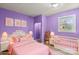 This pink bedroom includes a crib, bed, and open closet at 201 Indian Hill Rd, Union Grove, NC 28689