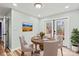Bright dining area features a wood table with seating, decor, and an exit to the outdoors at 201 Indian Hill Rd, Union Grove, NC 28689