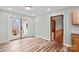 Bright dining room with wood-look floors and french doors to the backyard deck at 201 Indian Hill Rd, Union Grove, NC 28689