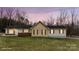 Charming single-story home featuring neutral siding, brick accents, and decorative shutters at 201 Indian Hill Rd, Union Grove, NC 28689