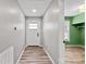 Inviting hallway showcasing wood floors and a doorway to another room at 201 Indian Hill Rd, Union Grove, NC 28689
