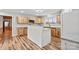 Updated kitchen featuring an island, stainless steel appliances, and modern lighting at 201 Indian Hill Rd, Union Grove, NC 28689