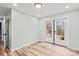 Bright room with light colored walls, wood flooring, and glass doors with access to the outside at 201 Indian Hill Rd, Union Grove, NC 28689