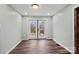 Bright room features light colored walls, hard floors, and glass doors with access to a balcony at 201 Indian Hill Rd, Union Grove, NC 28689