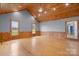 Spacious room featuring hardwood floors, wood trim, neutral colored walls, and bright windows at 201 Indian Hill Rd, Union Grove, NC 28689