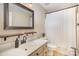Bathroom featuring a vanity, framed mirror, and toilet in the shower room at 202 Oakwood St, Stanfield, NC 28163