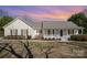 Charming home with a welcoming front porch, beautiful yard, and classic architectural details at 202 Oakwood St, Stanfield, NC 28163