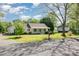 Single-story home with a front porch and a beautifully landscaped front yard at 202 Oakwood St, Stanfield, NC 28163