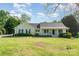 Charming single-story home with a welcoming front porch and well-maintained lawn at 202 Oakwood St, Stanfield, NC 28163
