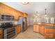 Spacious kitchen with stainless steel appliances and breakfast bar seating at 202 Oakwood St, Stanfield, NC 28163