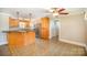 Open kitchen and dining area with stainless steel appliances at 202 Oakwood St, Stanfield, NC 28163