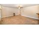 Comfortable living room with a neutral color scheme, ceiling fan, and easy access to other rooms at 202 Oakwood St, Stanfield, NC 28163