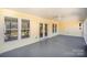Spacious screened-in porch with ample natural light and serene outdoor views at 202 Oakwood St, Stanfield, NC 28163