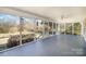 Spacious screened-in porch with ample natural light and serene outdoor views at 202 Oakwood St, Stanfield, NC 28163
