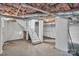 Unfinished basement features white-painted walls, exposed ceiling, and concrete floors at 203 E 22Nd St, Kannapolis, NC 28083