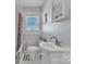 Clean bathroom with modern fixtures, subway tile and window with blinds at 203 E 22Nd St, Kannapolis, NC 28083