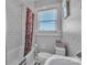 Clean bathroom with subway tile, shower with curtain, and a window at 203 E 22Nd St, Kannapolis, NC 28083