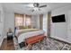 Bright bedroom with a flat screen TV, a ceiling fan, and neutral walls at 203 E 22Nd St, Kannapolis, NC 28083