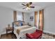 Bright bedroom featuring neutral walls, a decorative bench, and sheer curtains at 203 E 22Nd St, Kannapolis, NC 28083
