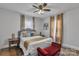 Bright bedroom featuring neutral walls, a decorative bench, and sheer curtains at 203 E 22Nd St, Kannapolis, NC 28083