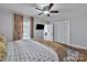 Bedroom featuring a ceiling fan, access to another room and an open closet at 203 E 22Nd St, Kannapolis, NC 28083