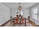 Elegant dining room features a modern light fixture, wood floors, and decorative wall texture at 203 E 22Nd St, Kannapolis, NC 28083