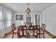 Elegant dining room features a modern light fixture, wood floors, and decorative wall texture at 203 E 22Nd St, Kannapolis, NC 28083