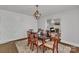 Elegant dining room features a modern light fixture, wood floors, and decorative wall texture at 203 E 22Nd St, Kannapolis, NC 28083